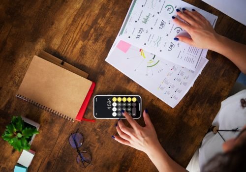 top-view-woman-working-as-economist-scaled-1.jpg